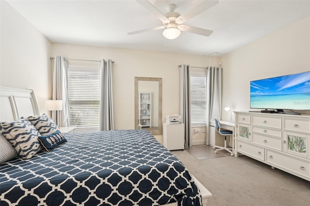 carpeted bedroom with a ceiling fan