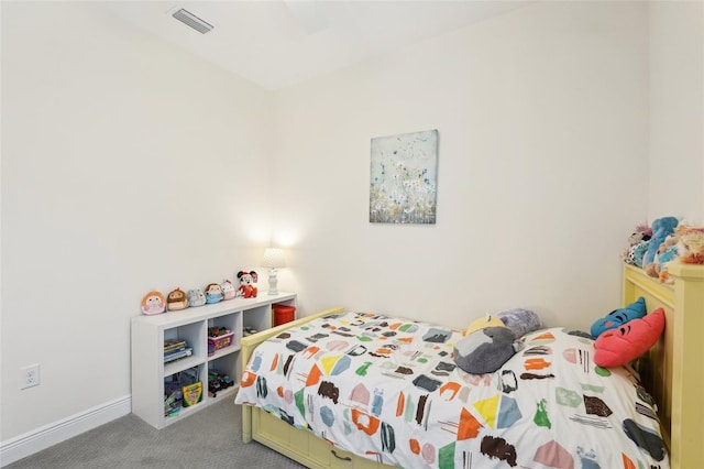 carpeted bedroom featuring visible vents, ceiling fan, and baseboards