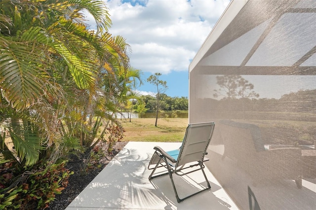 view of patio with a water view