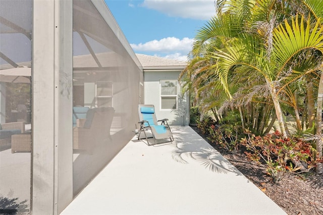 view of patio / terrace with a lanai