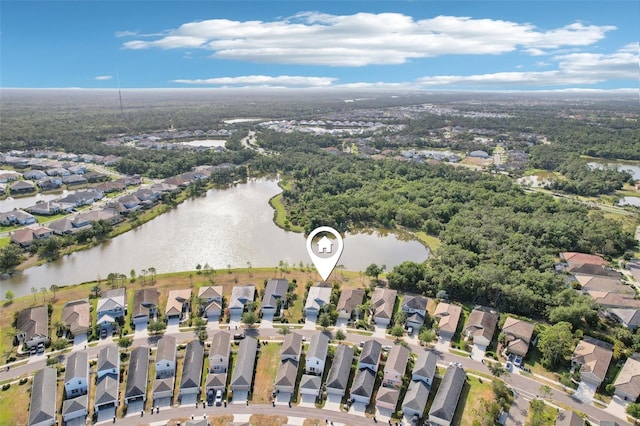 drone / aerial view with a residential view and a water view
