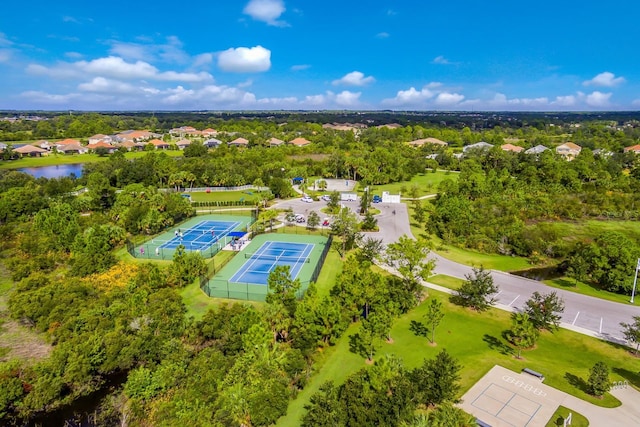 drone / aerial view featuring a residential view and a water view