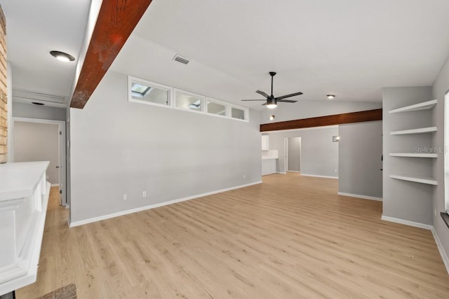 unfurnished living room with light wood-style flooring, vaulted ceiling, baseboards, visible vents, and ceiling fan