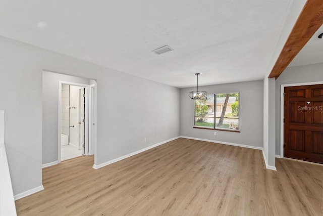 entrance foyer with light wood-type flooring, visible vents, baseboards, and an inviting chandelier