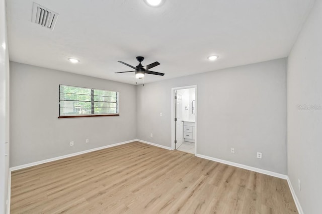 spare room with recessed lighting, visible vents, a ceiling fan, baseboards, and light wood-style flooring