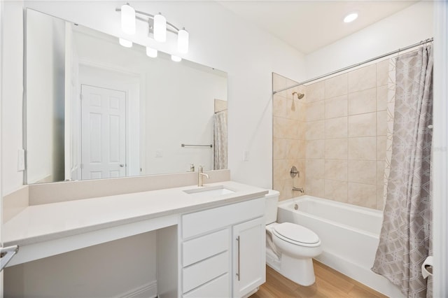 10455 Wet Marsh Cv, Parrish, FL 34219 - full bath featuring shower / bath combo with shower curtain, vanity, wood finished floors, and toilet