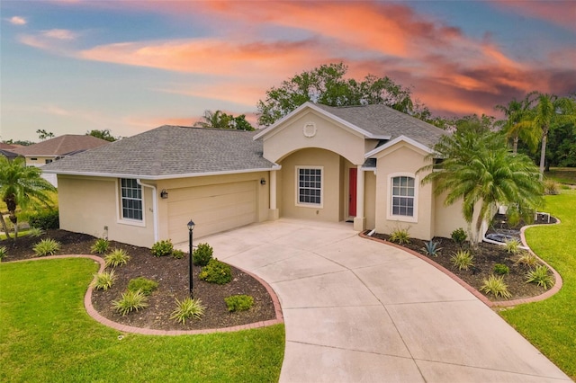 9101 Yarberry St, Sarasota, FL 34240 - ranch-style house featuring an attached garage, a front yard, stucco siding, and concrete driveway