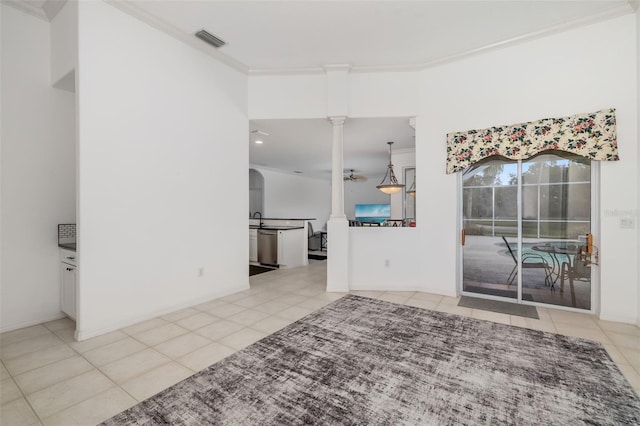 9101 Yarberry St, Sarasota, FL 34240 - unfurnished living room with ornate columns, crown molding, and tile patterned floors