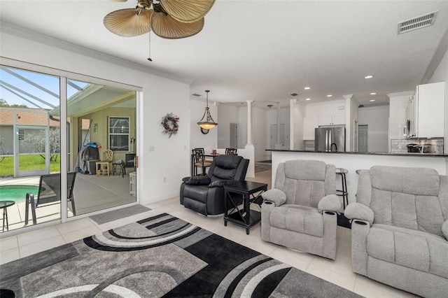 9101 Yarberry St, Sarasota, FL 34240 - living room with light tile patterned flooring, ceiling fan, ornamental molding, and recessed lighting