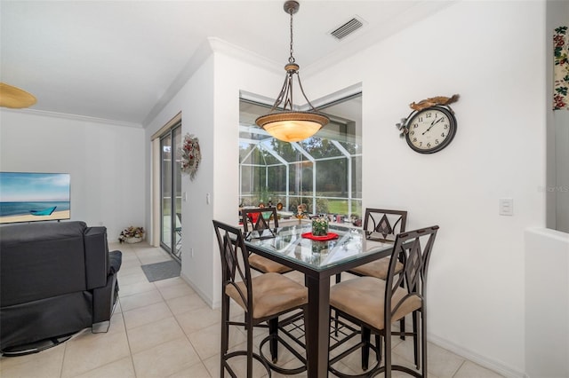 9101 Yarberry St, Sarasota, FL 34240 - dining space featuring a sunroom, ornamental molding, light tile patterned floors, and baseboards