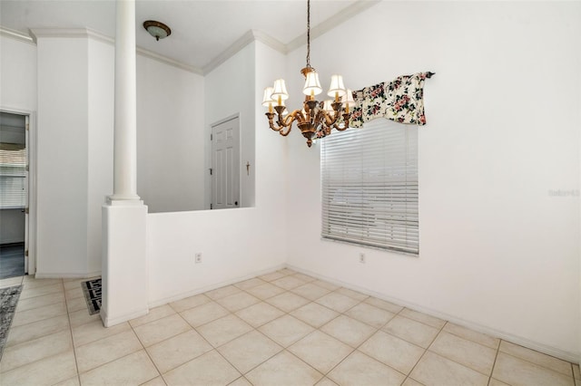 9101 Yarberry St, Sarasota, FL 34240 - unfurnished dining area featuring crown molding, a chandelier, ornate columns, and light tile patterned floors