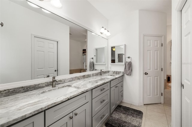 9101 Yarberry St, Sarasota, FL 34240 - full bathroom with double vanity, tile patterned flooring, and baseboards