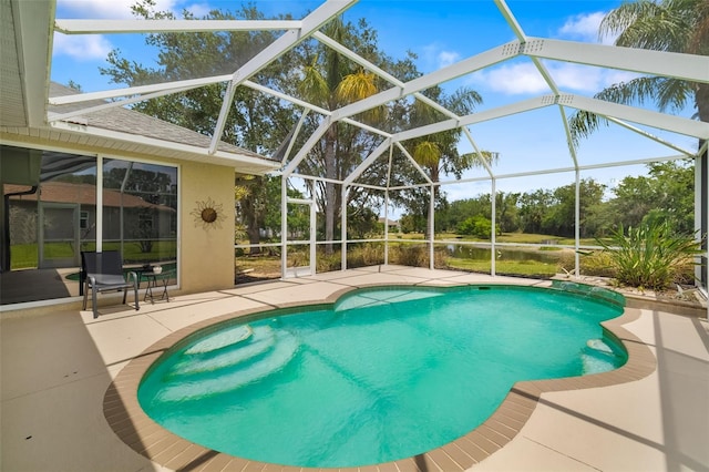 9101 Yarberry St, Sarasota, FL 34240 - outdoor pool featuring a patio area, glass enclosure, a water view, and view of scattered trees