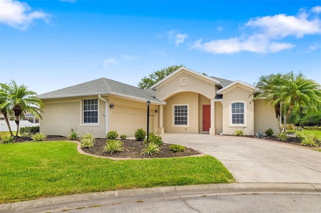 9101 Yarberry St, Sarasota, FL 34240 - ranch-style home with stucco siding, an attached garage, concrete driveway, and a front lawn
