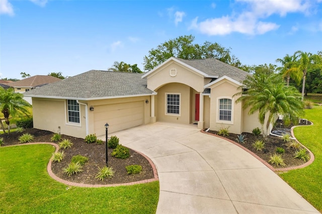 9101 Yarberry St, Sarasota, FL 34240 - single story home with a garage, stucco siding, a front lawn, and concrete driveway