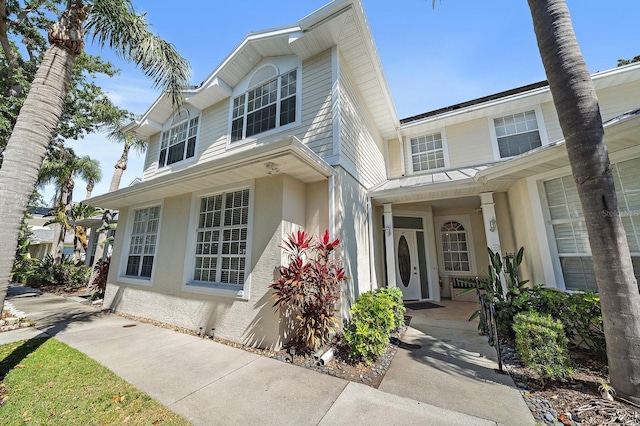 traditional-style house with stucco siding