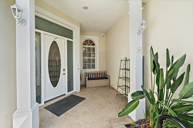 3405 54th Dr W Unit 102, Bradenton, FL 34210 - view of exterior entry with covered porch and stucco siding