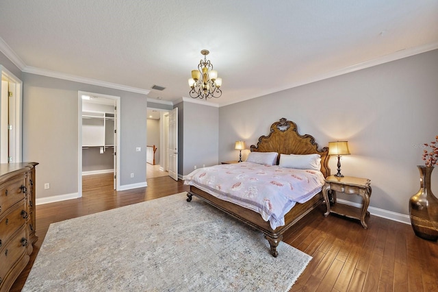 3405 54th Dr W Unit 102, Bradenton, FL 34210 - bedroom with a notable chandelier, baseboards, ornamental molding, and visible vents