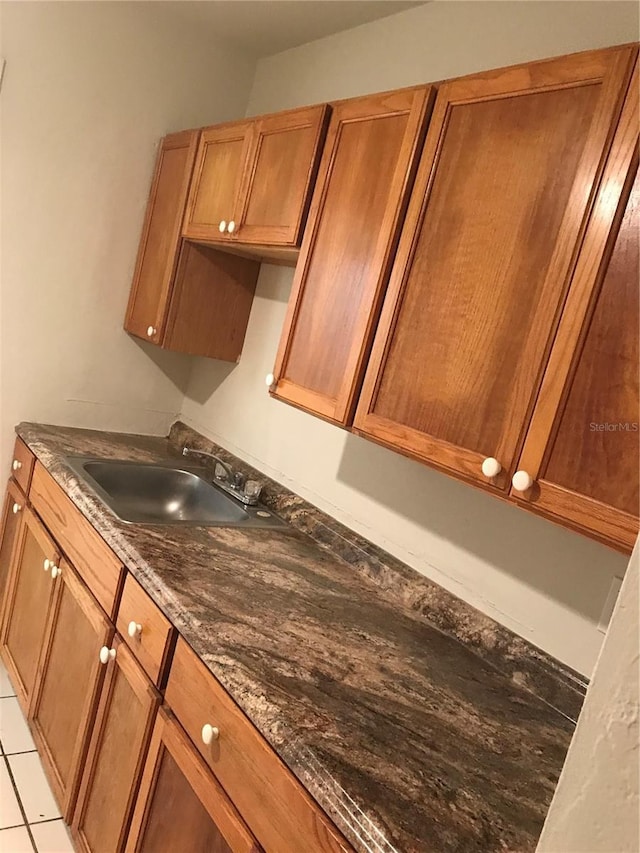 21291 Coulton Ave, Port Charlotte, FL 33952 - kitchen featuring a sink and brown cabinetry