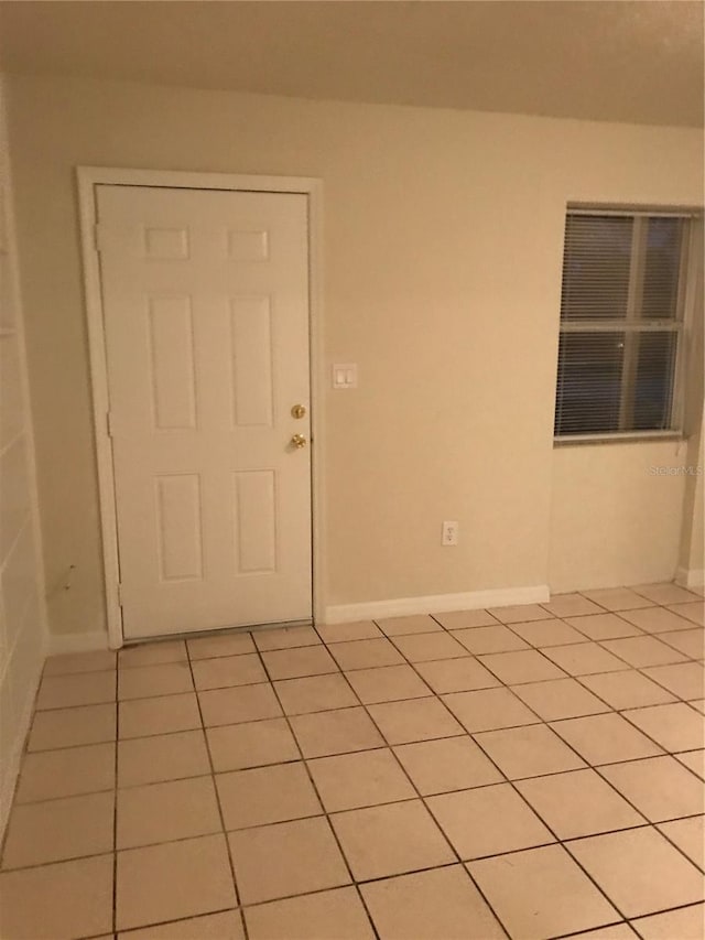 21291 Coulton Ave, Port Charlotte, FL 33952 - empty room featuring light tile patterned flooring and baseboards