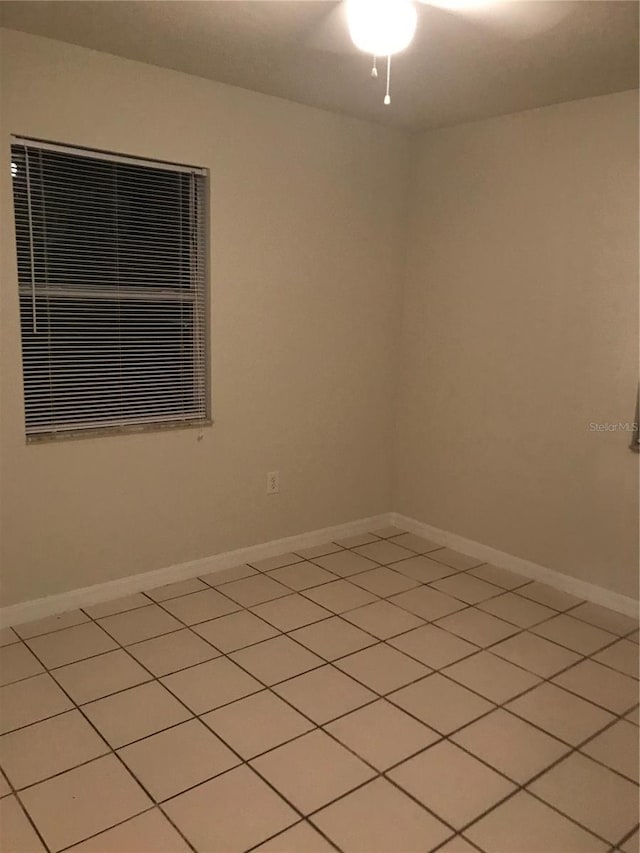 21291 Coulton Ave, Port Charlotte, FL 33952 - unfurnished room with light tile patterned floors and baseboards