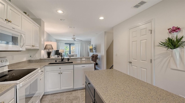 9008 White Sage Loop Unit 3605, Lakewood Ranch, FL 34202 - kitchen featuring recessed lighting, white appliances, visible vents, a sink, and white cabinets