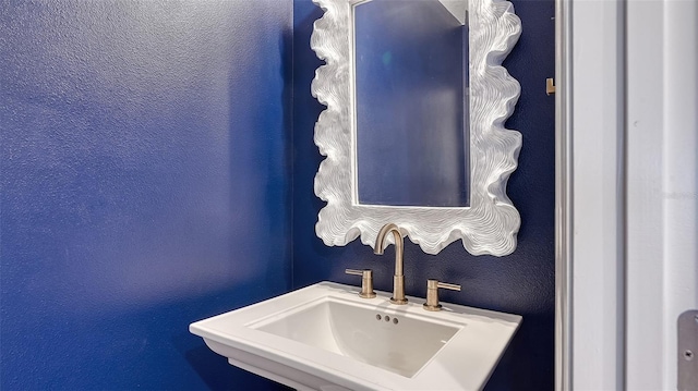 9008 White Sage Loop Unit 3605, Lakewood Ranch, FL 34202 - bathroom featuring a textured wall and a sink