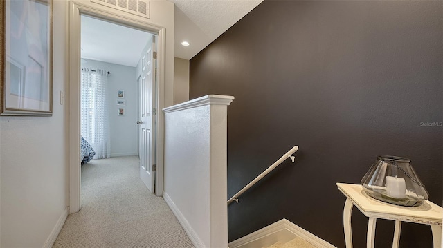 9008 White Sage Loop Unit 3605, Lakewood Ranch, FL 34202 - hall featuring carpet flooring, baseboards, an upstairs landing, and visible vents