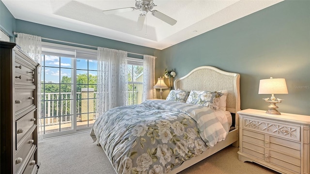 9008 White Sage Loop Unit 3605, Lakewood Ranch, FL 34202 - carpeted bedroom with a tray ceiling, ceiling fan, and access to exterior