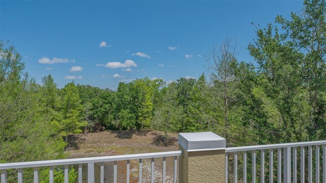 9008 White Sage Loop Unit 3605, Lakewood Ranch, FL 34202 - view of yard featuring a forest view and a balcony
