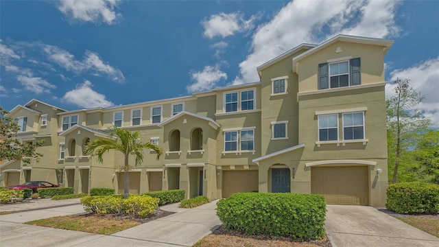 9008 White Sage Loop Unit 3605, Lakewood Ranch, FL 34202 - multi unit property with an attached garage, concrete driveway, stucco siding, and a residential view