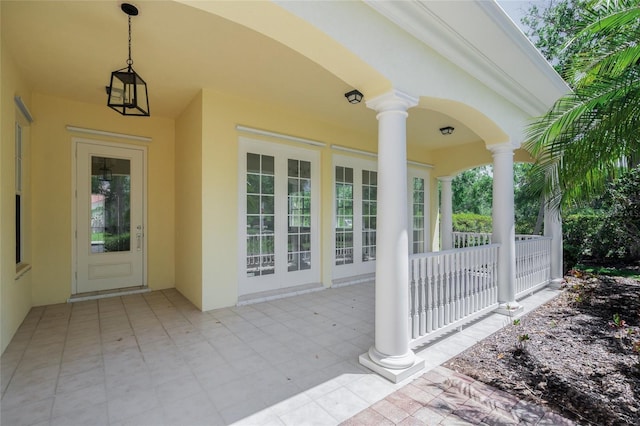 5821 Valente Pl, Sarasota, FL 34238 - view of exterior entry with a porch and stucco siding