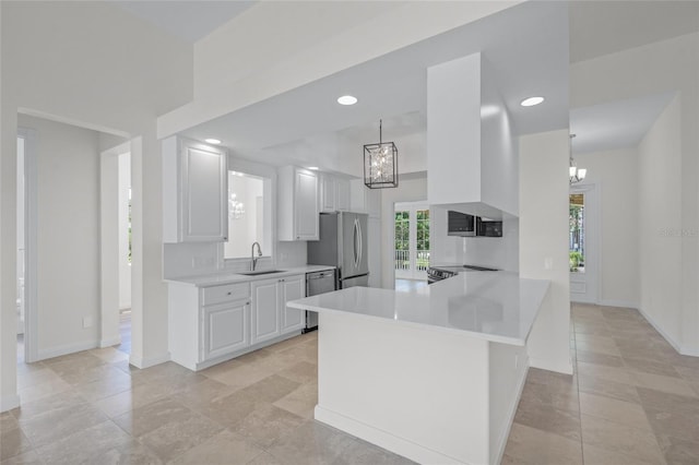 5821 Valente Pl, Sarasota, FL 34238 - kitchen featuring a chandelier, light countertops, appliances with stainless steel finishes, and a sink