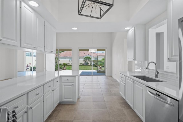 5821 Valente Pl, Sarasota, FL 34238 - kitchen with recessed lighting, light countertops, dishwasher, and a sink