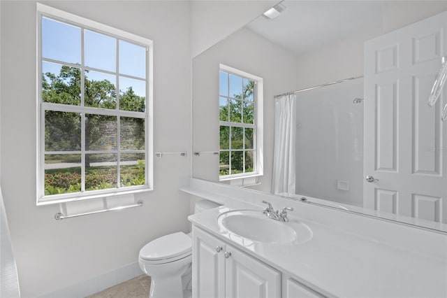 5821 Valente Pl, Sarasota, FL 34238 - full bathroom featuring a shower with curtain, vanity, tile patterned floors, toilet, and baseboards