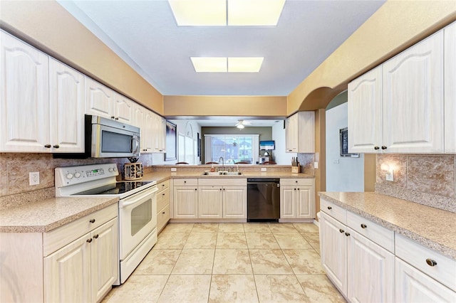 kitchen with a sink, dishwasher, light countertops, stainless steel microwave, and white electric stove