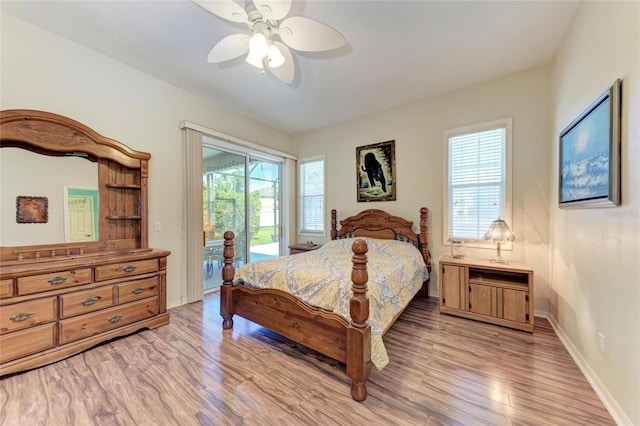 bedroom with light wood-style flooring, baseboards, a ceiling fan, and access to exterior