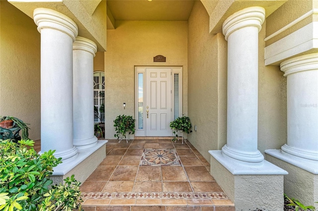 12838 Daisy Pl, Bradenton, FL 34212 - doorway to property featuring stucco siding and a porch