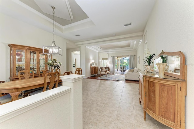 12838 Daisy Pl, Bradenton, FL 34212 - hall with a tray ceiling, a chandelier, light tile patterned floors, and crown molding