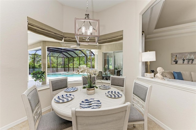 12838 Daisy Pl, Bradenton, FL 34212 - dining space featuring a sunroom, a chandelier, and ornamental molding