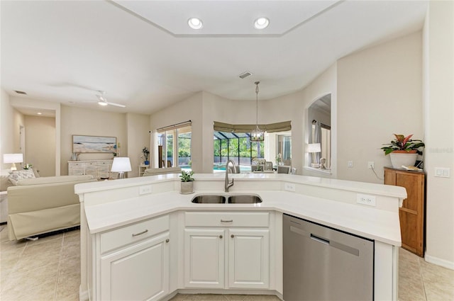 12838 Daisy Pl, Bradenton, FL 34212 - kitchen with stainless steel dishwasher, open floor plan, light tile patterned flooring, light countertops, and a ceiling fan
