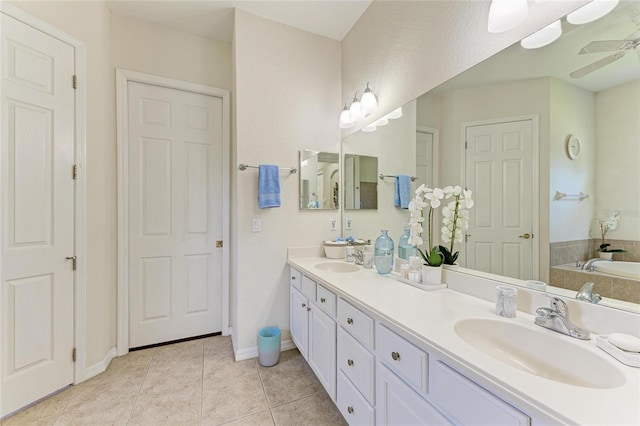 12838 Daisy Pl, Bradenton, FL 34212 - bathroom featuring double vanity, a garden tub, tile patterned floors, and ceiling fan