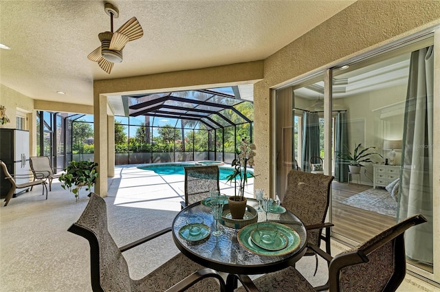 12838 Daisy Pl, Bradenton, FL 34212 - view of patio / terrace with an outdoor pool, an in-ground hot tub, a lanai, and outdoor dining area