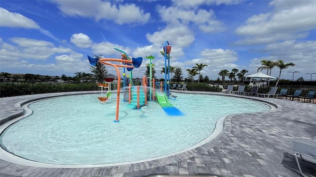 4970 Oyster Pearl St, Lakewood Ranch, FL 34211 - community playground with a community pool, fence, and a water play area