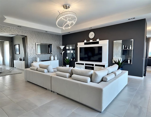 4970 Oyster Pearl St, Lakewood Ranch, FL 34211 - living room featuring a tray ceiling, plenty of natural light, a chandelier, and an accent wall