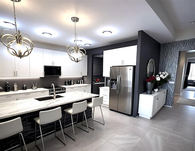 4970 Oyster Pearl St, Lakewood Ranch, FL 34211 - kitchen featuring a sink, a kitchen breakfast bar, pendant lighting, a notable chandelier, and stainless steel refrigerator with ice dispenser
