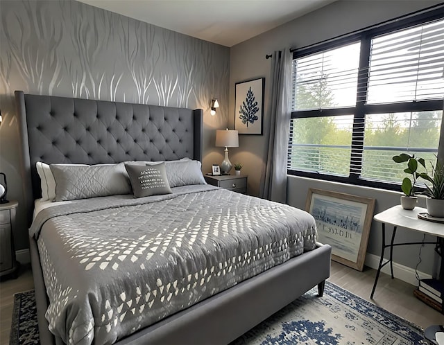 4970 Oyster Pearl St, Lakewood Ranch, FL 34211 - bedroom featuring wood finished floors, baseboards, and an accent wall