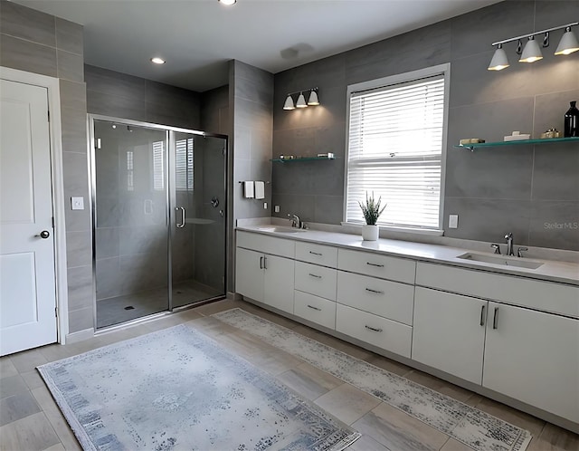 4970 Oyster Pearl St, Lakewood Ranch, FL 34211 - full bath featuring tile walls, double vanity, and a sink
