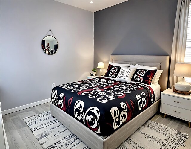 4970 Oyster Pearl St, Lakewood Ranch, FL 34211 - bedroom with baseboards and light wood-style floors