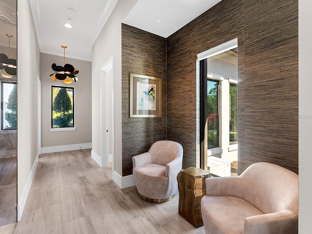 hallway with baseboards and light wood finished floors
